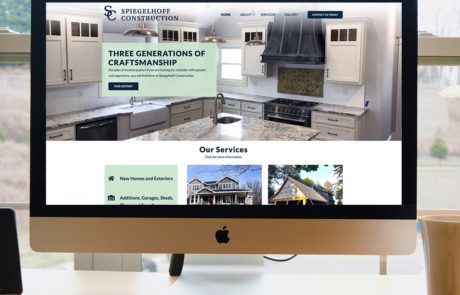Computer displaying website design and website development of the Spiegelhoff Construction company website