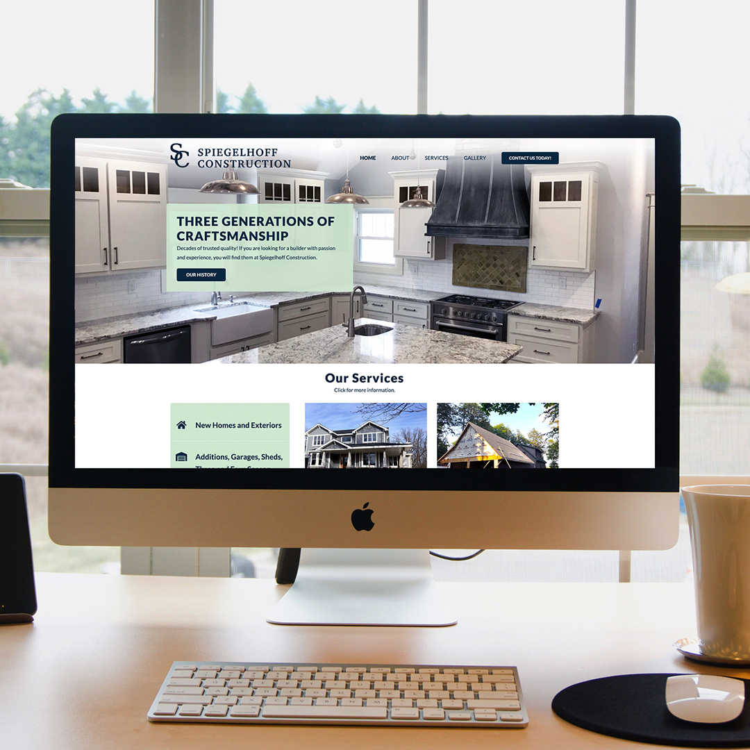 Computer displaying website design and website development of the Spiegelhoff Construction company website